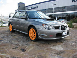 Photoshop request! Can someone change the wheel color of this STi?-orange2.jpg