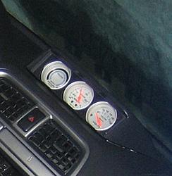 Autometer triple gauge w/clock pod-gauges.jpg