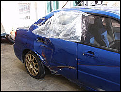 Been out for a year.....crashed STI's-blue-sti-gaurdrail-01.jpg